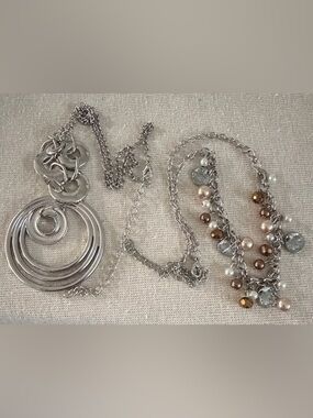 Two Paparazzi Necklaces each different and elegant.
